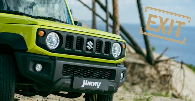 grüner Suzuki Jeep mit Aufschrift Jimmy